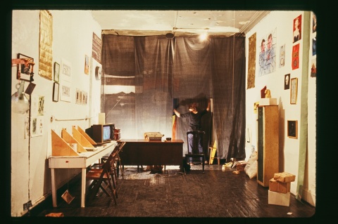 Coleen Fitzgibbon installing the exhibition "Income and Wealth" at 5 Bleecker Street, New York, 1979.