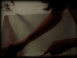 Still from "Restoring Appearance to Order in 12 Min." (16mm) by Coleen Fitzgibbon